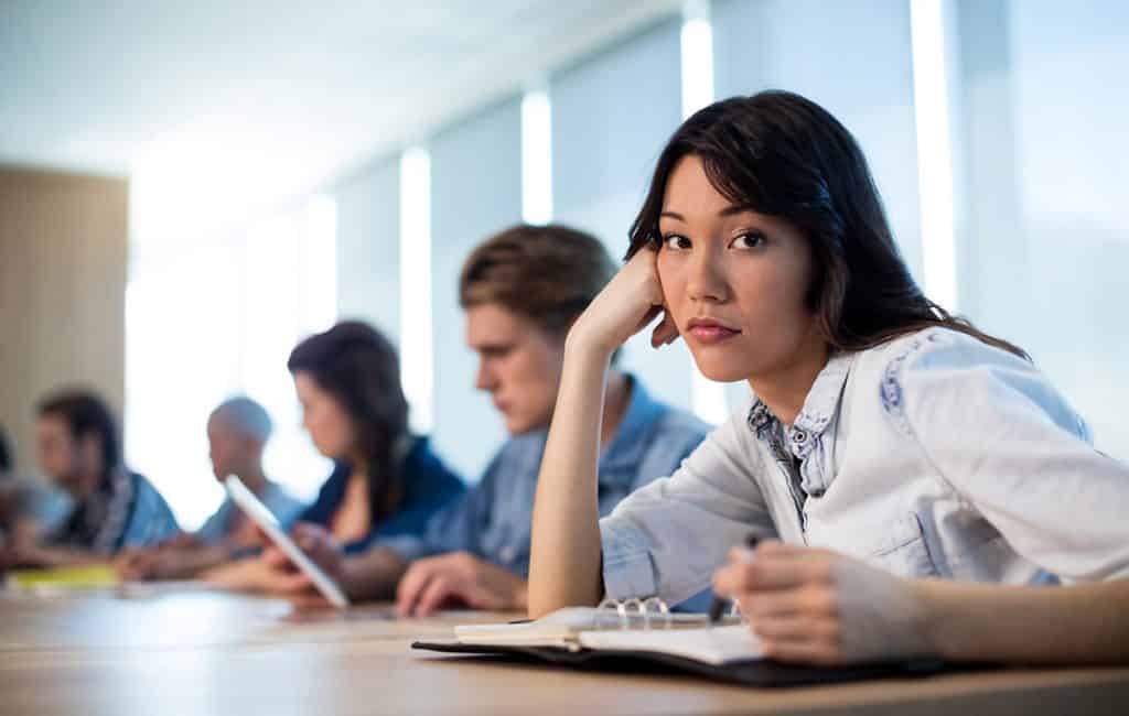 woman looking bored in a meeting